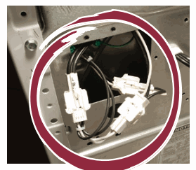 Two Greenwald Pay power plugs connected to the machine power source