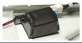 Greenwald Pay power conditioner secured with the included double-sided tape